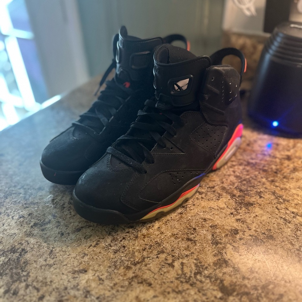 Black Sneakers with Red and Yellow Accents